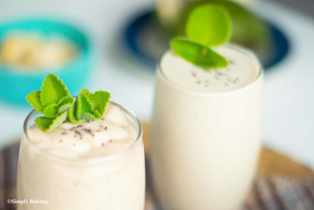 Smoothie topped with leaves and seeds