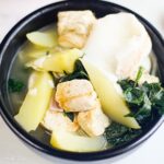 One vegan Binakol serving in a black bowl