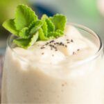 White creamy juice with chia seeds on top