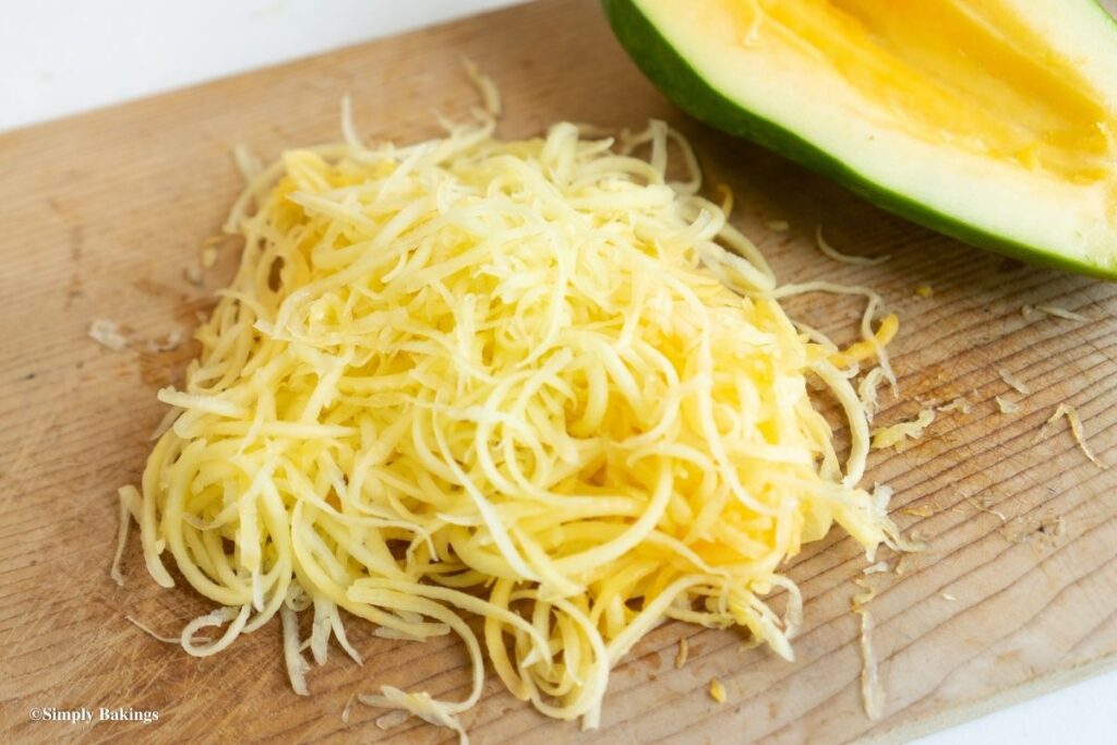 grated papaya on a chopping board