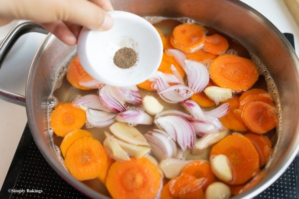 adding pepper to the atsara pickling solution