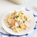 Filipino macaroni salad served on a white dessert plate