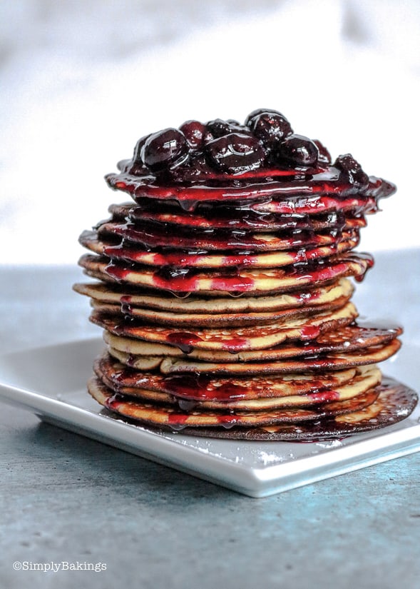 a delicious stack of keto blueberry pancakes on a white plate