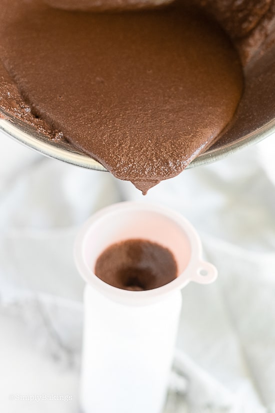 pouring the chocolate pancake batter into a squeeze bottle