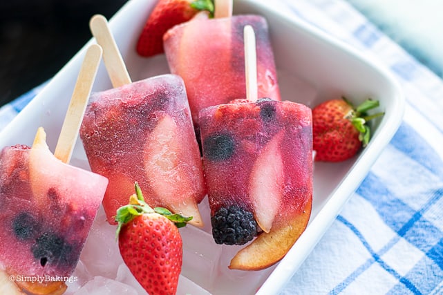 four pieces of vegan fruit popsicles in a container