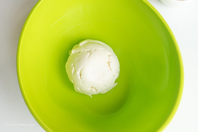 cream in a green mixing bowl for buko pandan ice cream