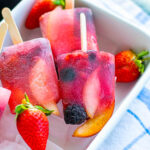 3 vegan fruit popsicles in a tray
