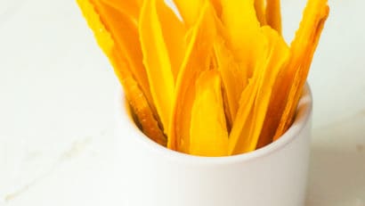 dried mangos in a white cup