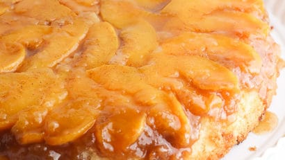 Peach Upside Down Cake on a white stand