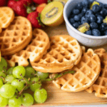 waffles in wooden board with fruits