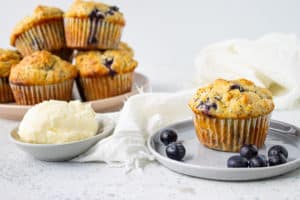 blueberry lemon poppy seed muffins on a blue plate