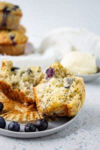 blueberry lemon poppy seed muffins halved on a table