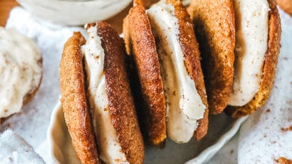 birds eye view of 3 pumpkin whoopie pies in a white dish