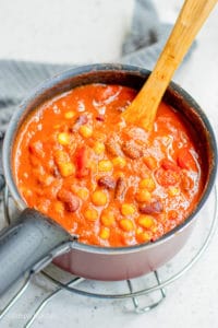 pumpkin chili simmering in a saucepan