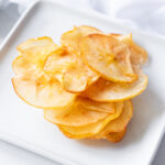 Apple chips on a silver tray
