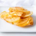 cinnamon apple chips on a white plate