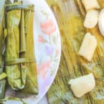 suman on banana leaves sliced and placed on a plate
