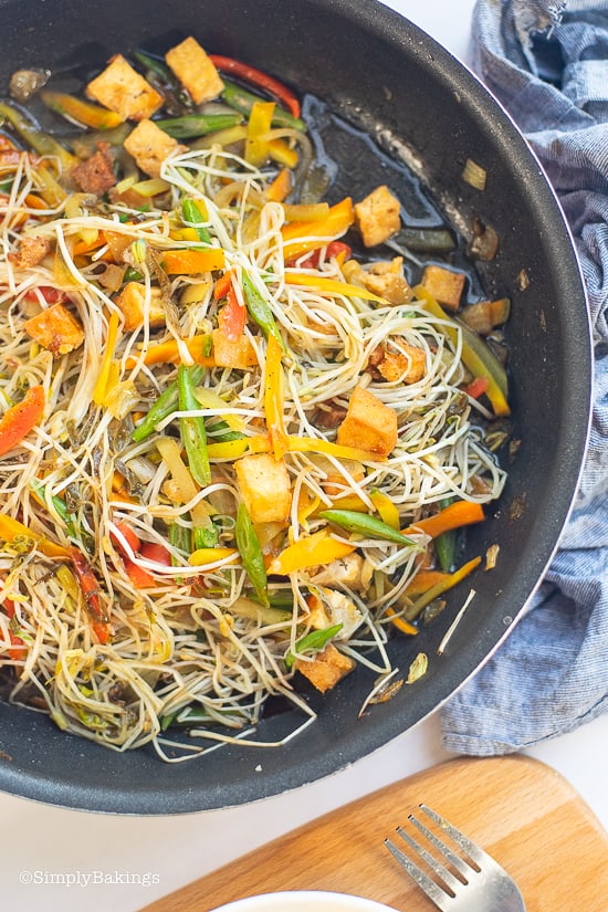 a bowl of stir fried mung bean sprouts with tofu and vegetables