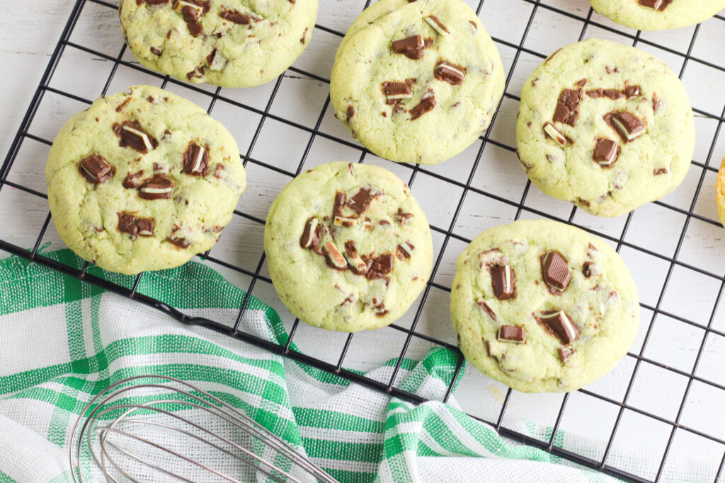 baked mint chocolate chip cookies on a cooling rack