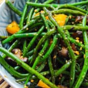 a bowl of stir fried green beans with black bean sauce