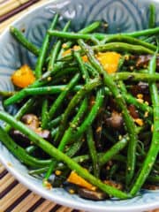 a bowl of stir fried green beans with black bean sauce