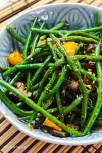 a bowl of stir fried green beans with black bean sauce