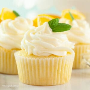 lemon cupcakes topped with cream cheese frosting