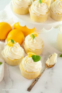 lemon cupcakes on counter and cake stand