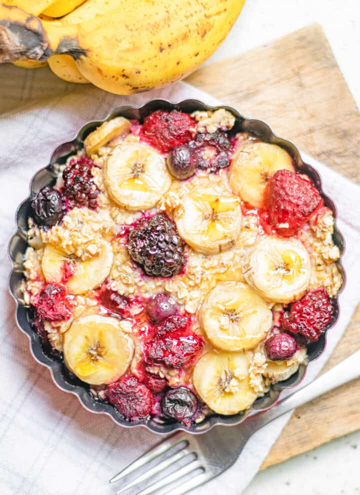 baked berries banana oats in a baking dish
