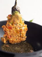 fried tortang talong or eggplant omelette in a pan