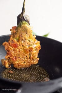 fried tortang talong or eggplant omelette in a pan