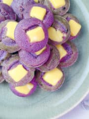 ube puto with cheese on a plate