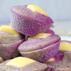 ube puto (purple yam steamed rice cake) topped with cheese