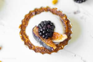 delicious fig blackberry tart on a table