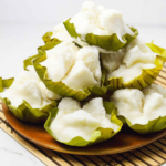 fluffy putong bigas stacked on a bowl