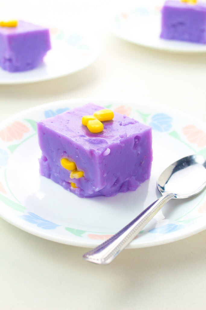 Ube Maja Blanca on a plate with spoon