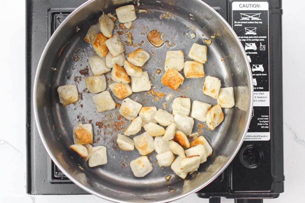 sautéed tofu balls in a pan 