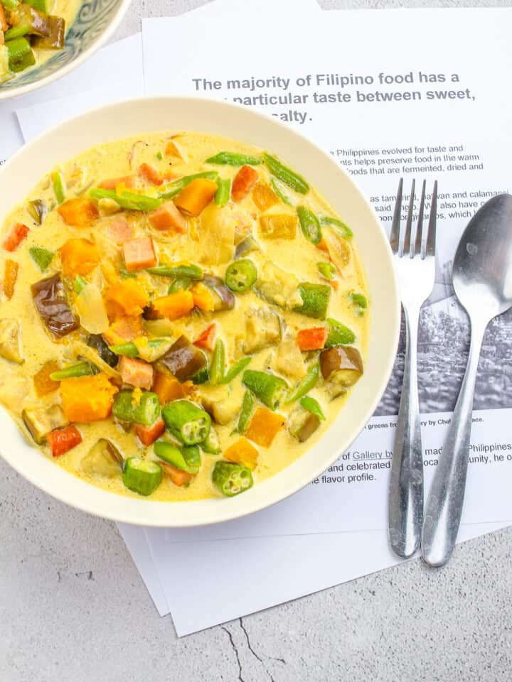 a bowl of ginataang gulay with stainless spoon and fork