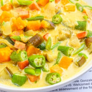 creamy and healthy ginataang gulay (vegetables in coconut milk) served in a while bowl
