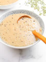 delicious and sweet ginataang munggo in a bowl with wooden serving spoon