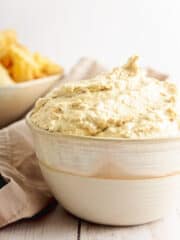 vegan caramelized onion dip in a white bowl