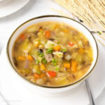 sour cabbage soup served in a white bowl