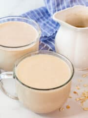 creamy and delicious homemade oat milk served in cups
