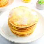stacked filipino hotcakes sprinkled with white sugar