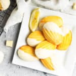 chocolate dipped lemon madeleines in white square plate
