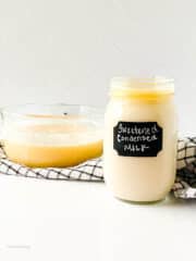 delicious homemade sweetened condensed milk in a glass bowl and jar