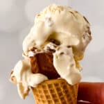 melting goodness of cheesecake ice cream with biscoff on a cone