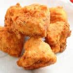 fried vegan tofu chunks set on a plate