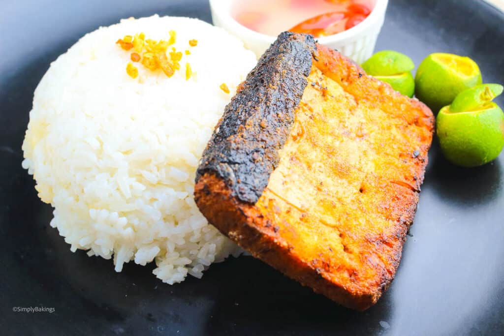 crispy fried Filipino vegetarian bangus marinade served with a steamed rice, sauce, and calamansi slices