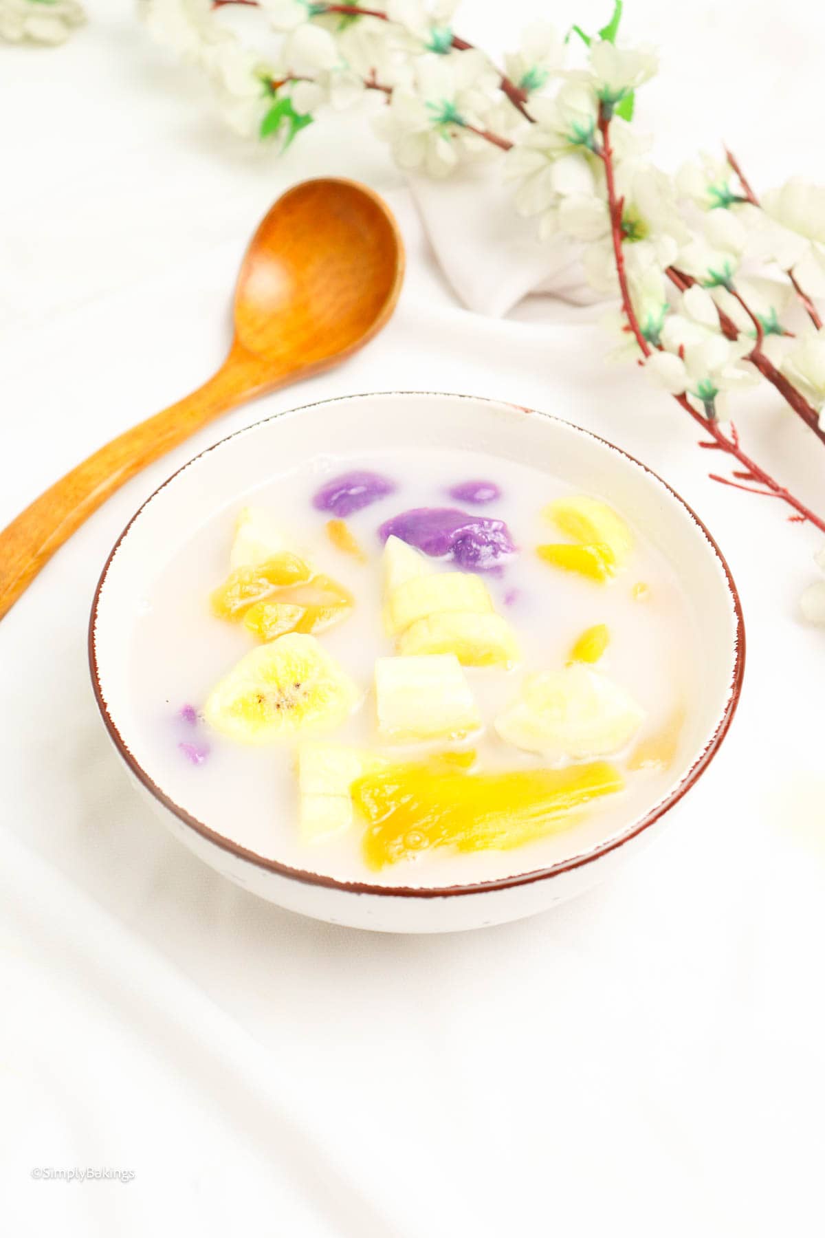 creamy filipino bilo bilo on a bowl with wooden spoon